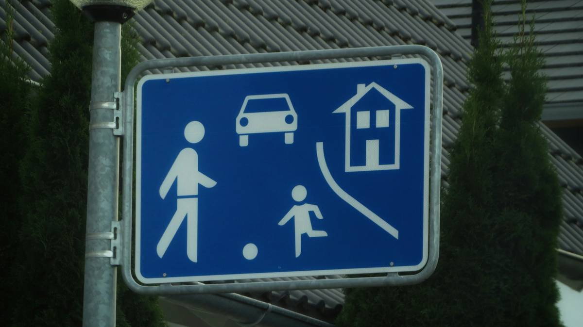 A family sitting safely inside while a notification shows a blocked intrusion attempt