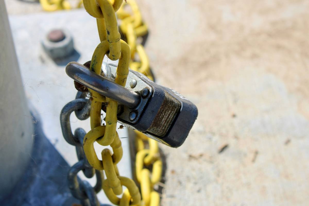 A close-up of a locked metal chain outdoors