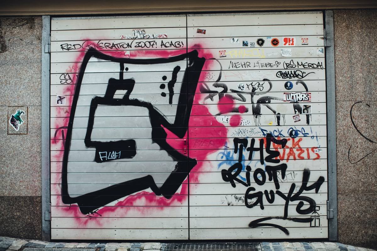 Vandalism graffiti and quotes "The Riot Guys"